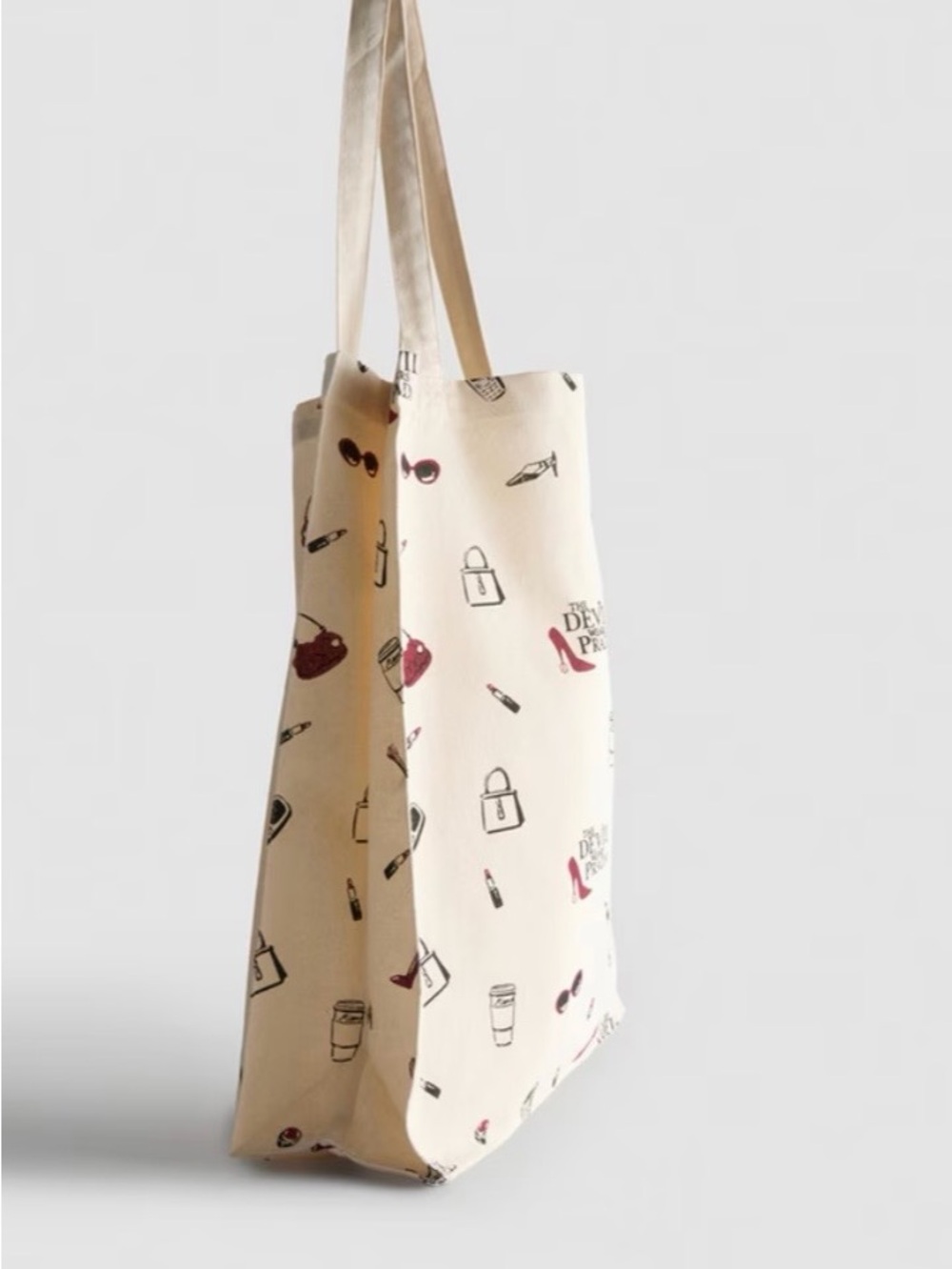 The Devil Wears Prada Cream Canvas Tote with Red Accent Prints - Picture 2 of 3